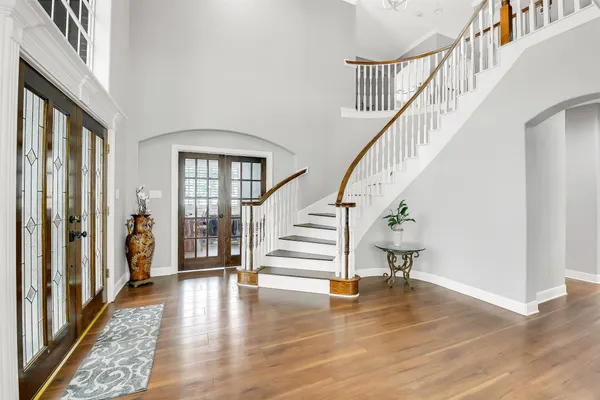 a view of staircase with white walls and windows