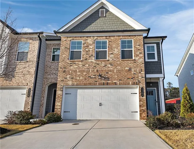a front view of a house with yard