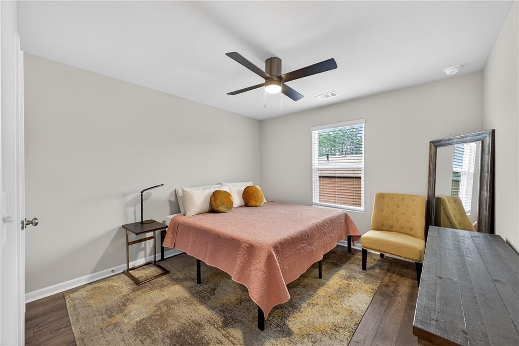 1104 Elyse Lane Mableton, GA 30126 - Photo 13 of 27 a bedroom with a bed and window