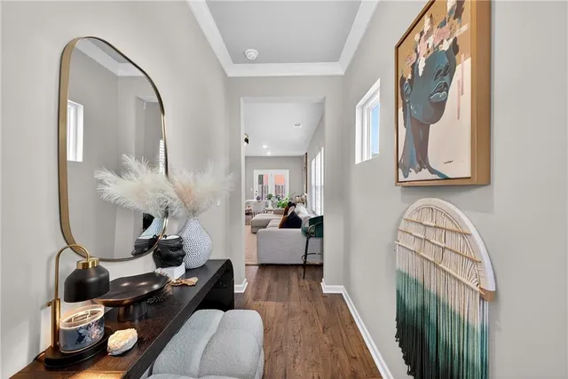 a living room with furniture and a mirror