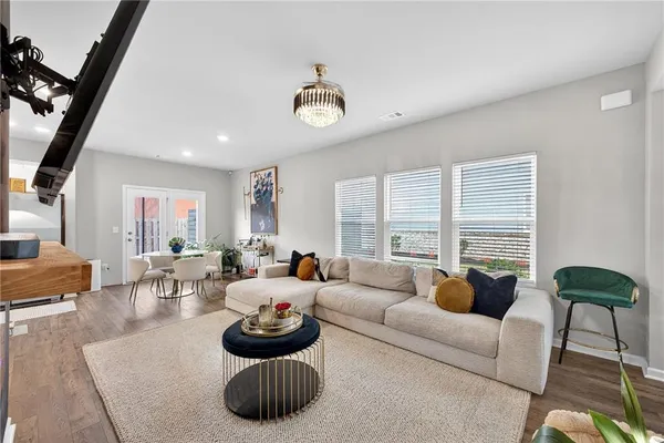 a living room with furniture and a large window