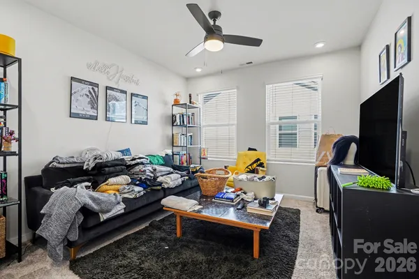 a living room with furniture fireplace and a flat screen tv