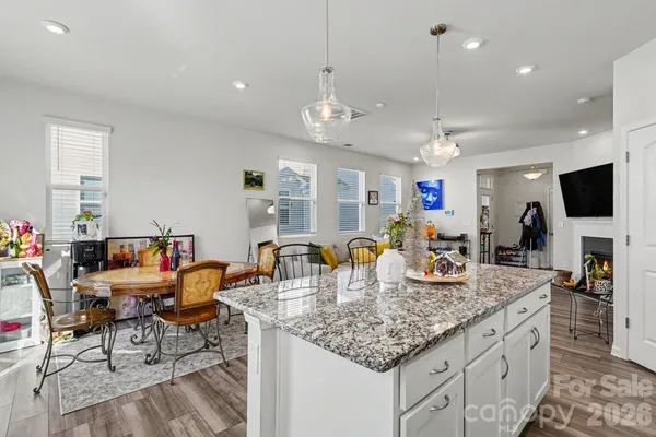 a kitchen with counter space cabinets and living room