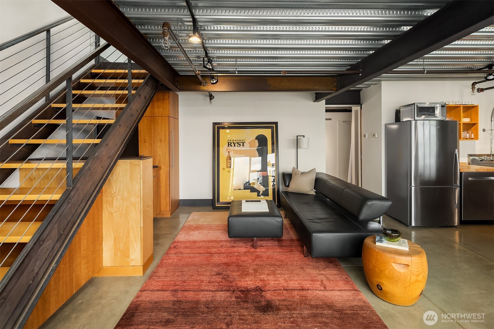 1310 East Union Street, Unit 501 Seattle, WA 98122 - Photo 17 of 30 a living room with furniture and a couch