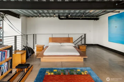 a room with lots of furniture and a book shelf