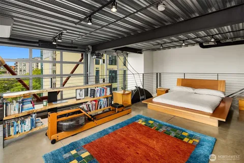 a living room with furniture and a pool table