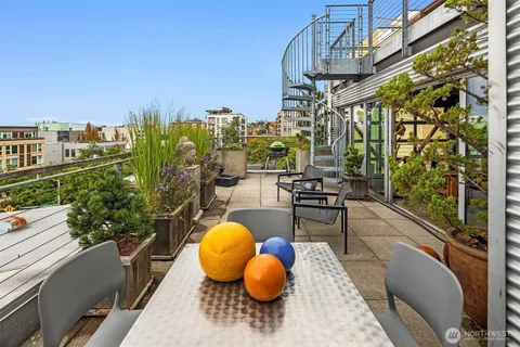 a view of a swimming pool with outdoor seating