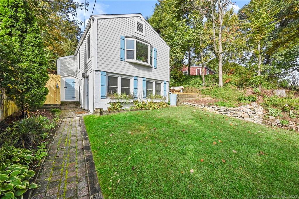 25 Underhill Road Newtown, CT 06482 - Photo 1 of 1 a front view of a house with a yard and green space