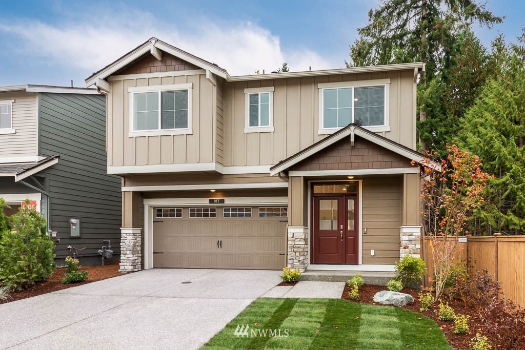 31 211th Street Southeast, Unit P15 Bothell, WA 98021 - Photo 1 of 40 a front view of a house with a yard and garage