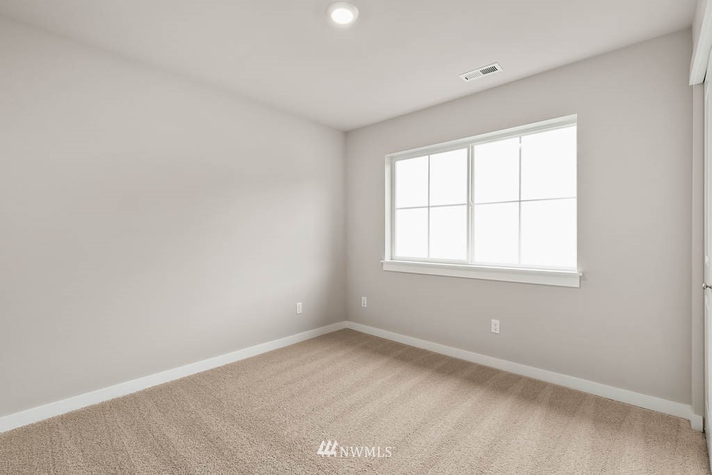 31 211th Street Southeast, Unit P15 Bothell, WA 98021 - Photo 13 of 40 an empty room with a window