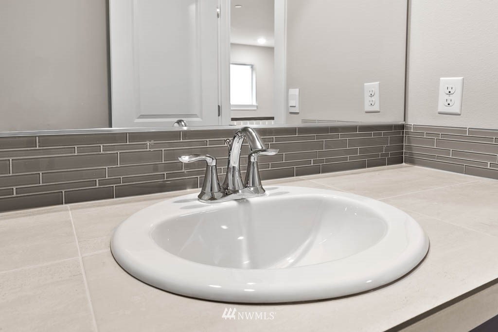31 211th Street Southeast, Unit P15 Bothell, WA 98021 - Photo 15 of 40 a bathroom with a sink and a mirror