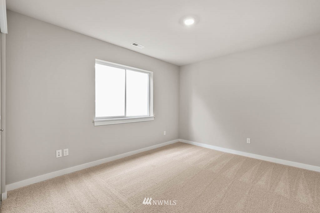 31 211th Street Southeast, Unit P15 Bothell, WA 98021 - Photo 17 of 40 an empty room with a window