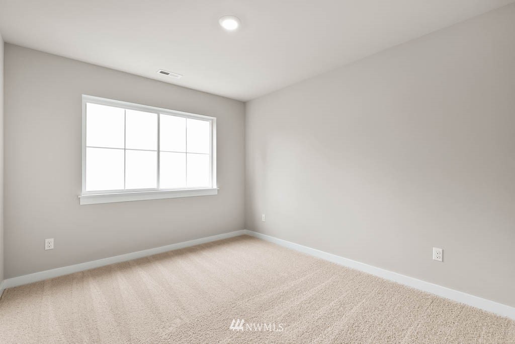 31 211th Street Southeast, Unit P15 Bothell, WA 98021 - Photo 19 of 40 an empty room with windows