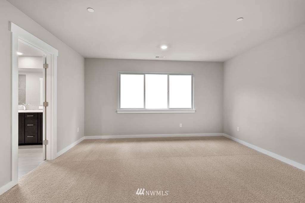 31 211th Street Southeast, Unit P15 Bothell, WA 98021 - Photo 21 of 40 an empty room with windows and closet