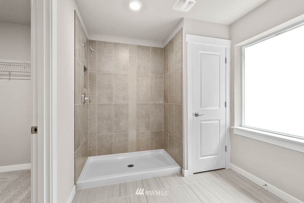 31 211th Street Southeast, Unit P15 Bothell, WA 98021 - Photo 24 of 40 a bathroom with a tub and shower