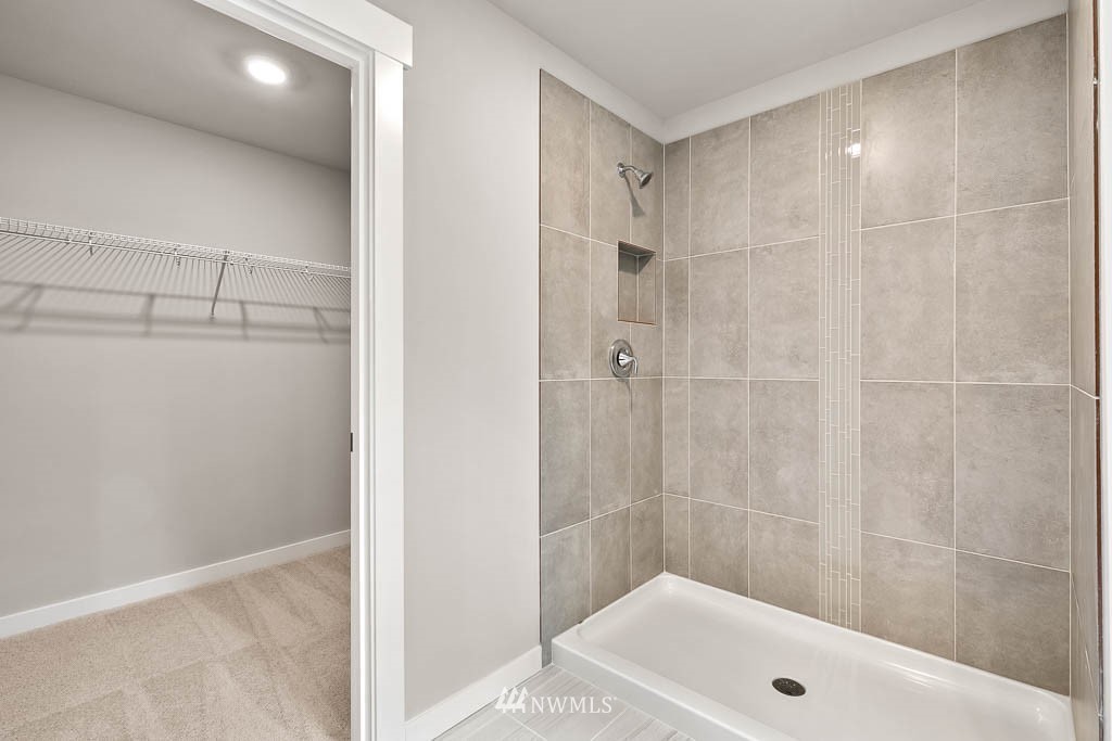 31 211th Street Southeast, Unit P15 Bothell, WA 98021 - Photo 25 of 40 a bathroom with a tub and shower