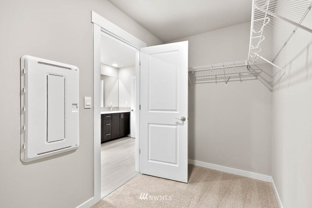 31 211th Street Southeast, Unit P15 Bothell, WA 98021 - Photo 26 of 40 a view of a kitchen with white cabinets and wooden floor