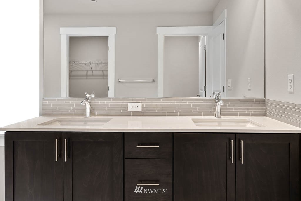 31 211th Street Southeast, Unit P15 Bothell, WA 98021 - Photo 27 of 40 a bathroom with a sink and a mirror