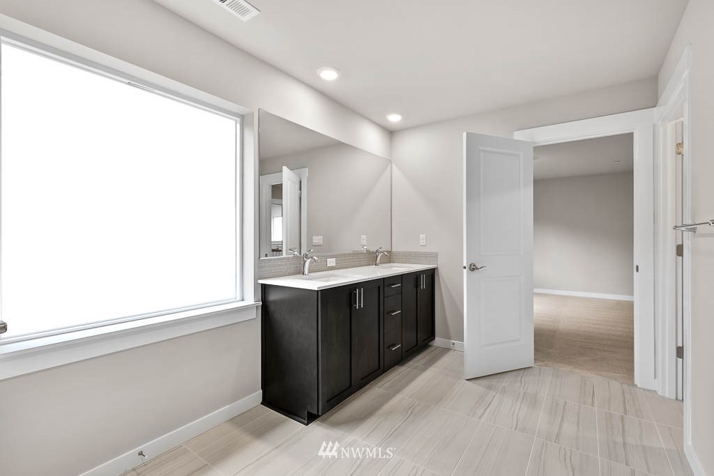 31 211th Street Southeast, Unit P15 Bothell, WA 98021 - Photo 29 of 40 a bathroom with a sink and a mirror