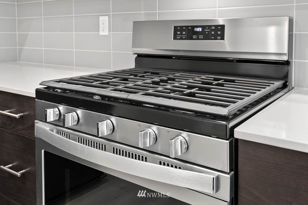31 211th Street Southeast, Unit P15 Bothell, WA 98021 - Photo 31 of 40 a close view of a stove a microwave and cabinets