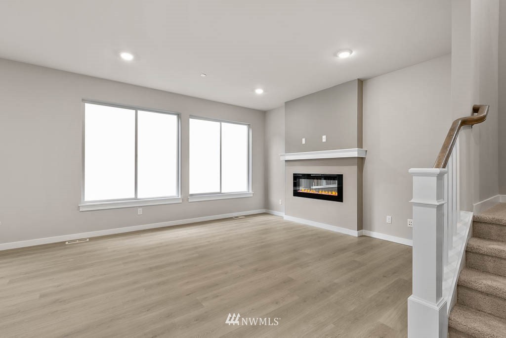 31 211th Street Southeast, Unit P15 Bothell, WA 98021 - Photo 33 of 40 a view of an empty room with a window and fireplace