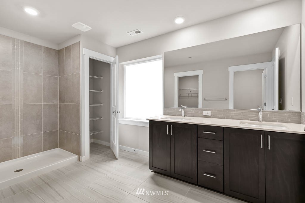 31 211th Street Southeast, Unit P15 Bothell, WA 98021 - Photo 9 of 40 a bathroom with a sink and a mirror