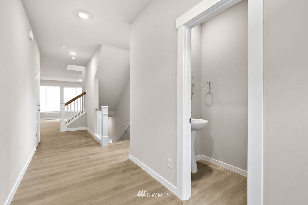 31 211th Street Southeast, Unit P15 Bothell, WA 98021 - Photo 10 of 40 a view of a hallway with wooden floor and staircase