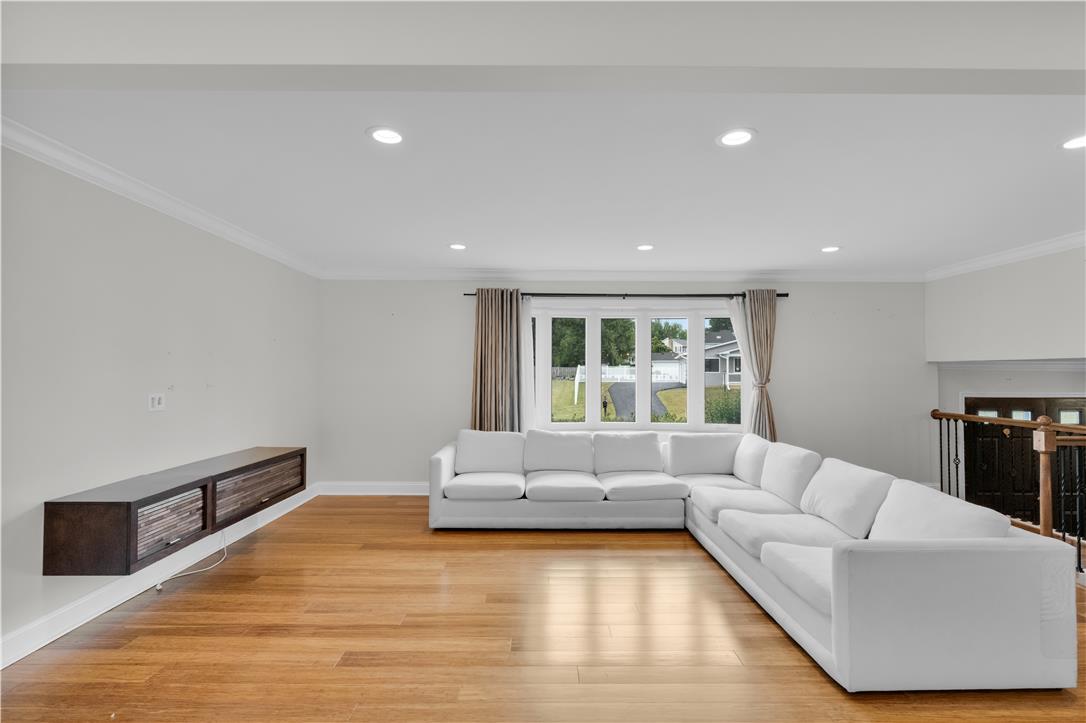 3396 Darien Road Bethlehem, PA 18020 - Photo 17 of 44 Hardwood floors and ample recessed lighting elevate this inviting living space.