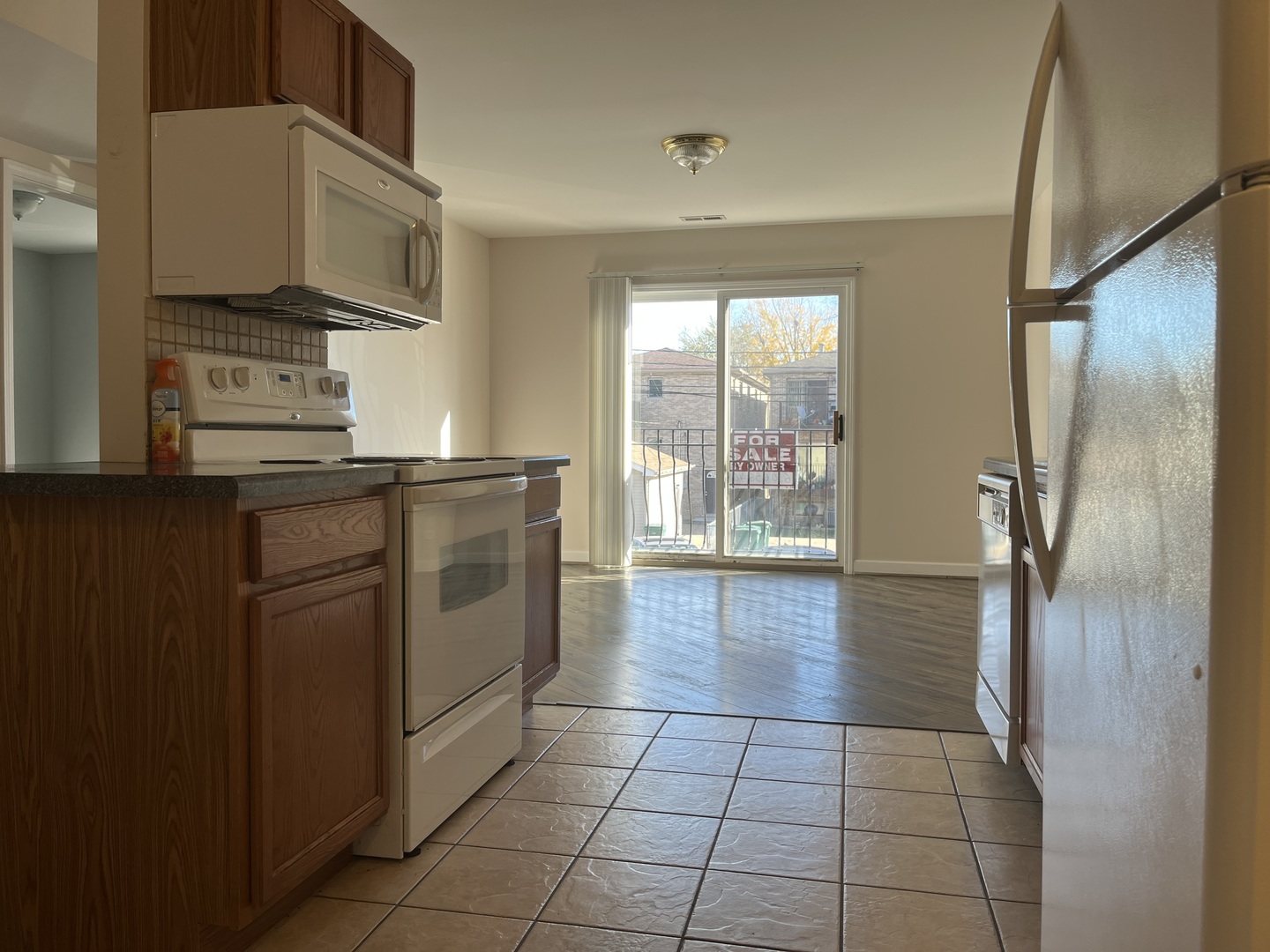 3431 Ridgeland Avenue, Unit 203 Berwyn, IL 60402 - Photo 6 of 18 a kitchen with stainless steel appliances granite countertop a refrigerator a sink a stove top oven a counter space and cabinets