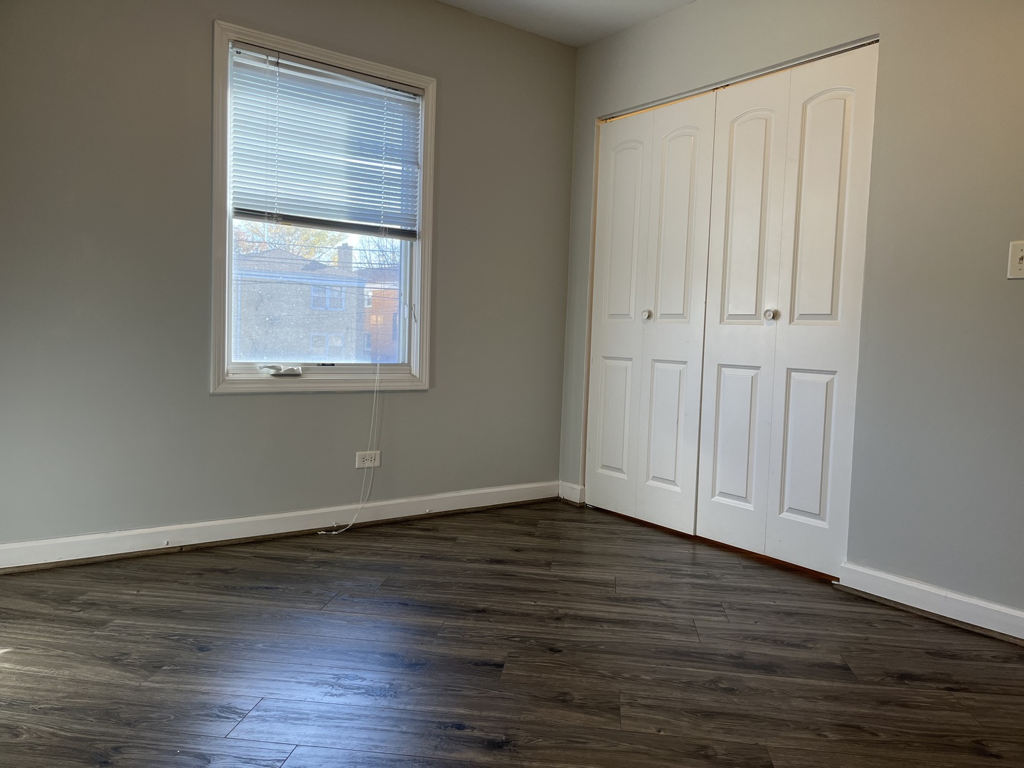 3431 Ridgeland Avenue, Unit 203 Berwyn, IL 60402 - Photo 10 of 18 an empty room with wooden floor and windows