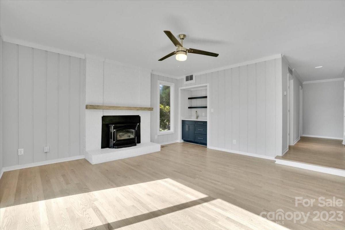 8301 Raintree Lane Charlotte, NC 28277 - Photo 11 of 42 a view of a livingroom with a fireplace and window