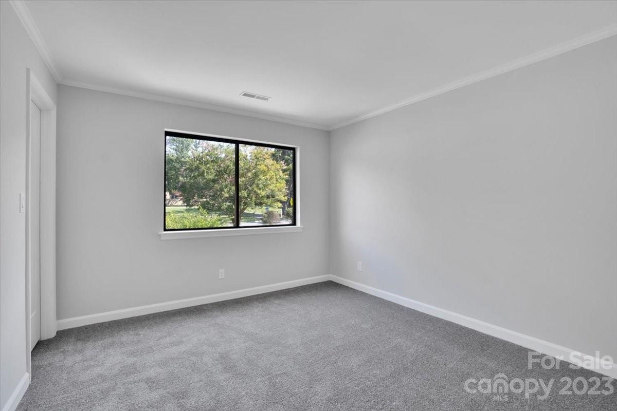 8301 Raintree Lane Charlotte, NC 28277 - Photo 31 of 42 an empty room with windows