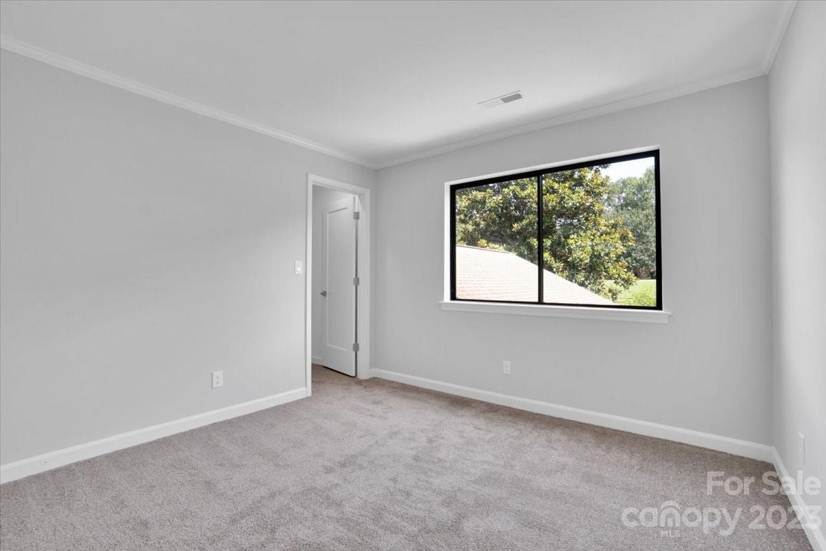 8301 Raintree Lane Charlotte, NC 28277 - Photo 33 of 42 an empty room with a window