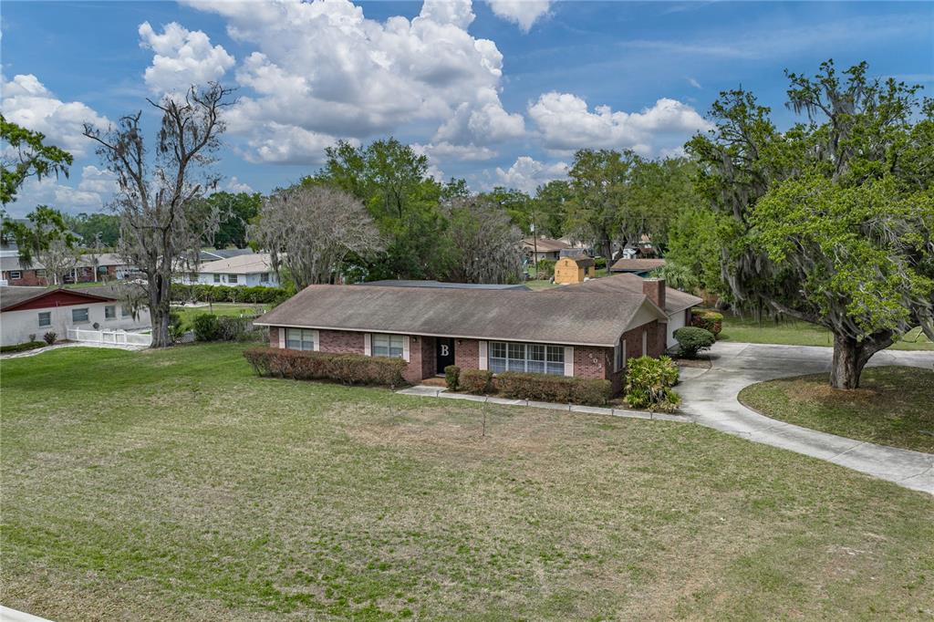 609 West Pipkin Road Lakeland, FL 33813 - Photo 66 of 72 a house with trees in the background