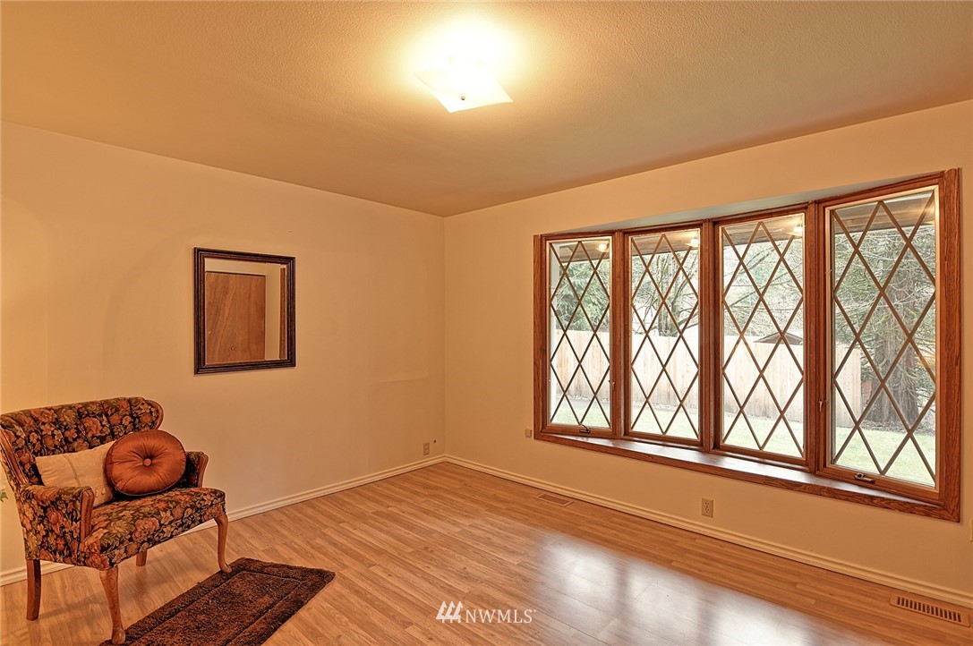 5011 228th Street Southeast Bothell, WA 98021 - Photo 14 of 40 a living room with furniture and wooden floor