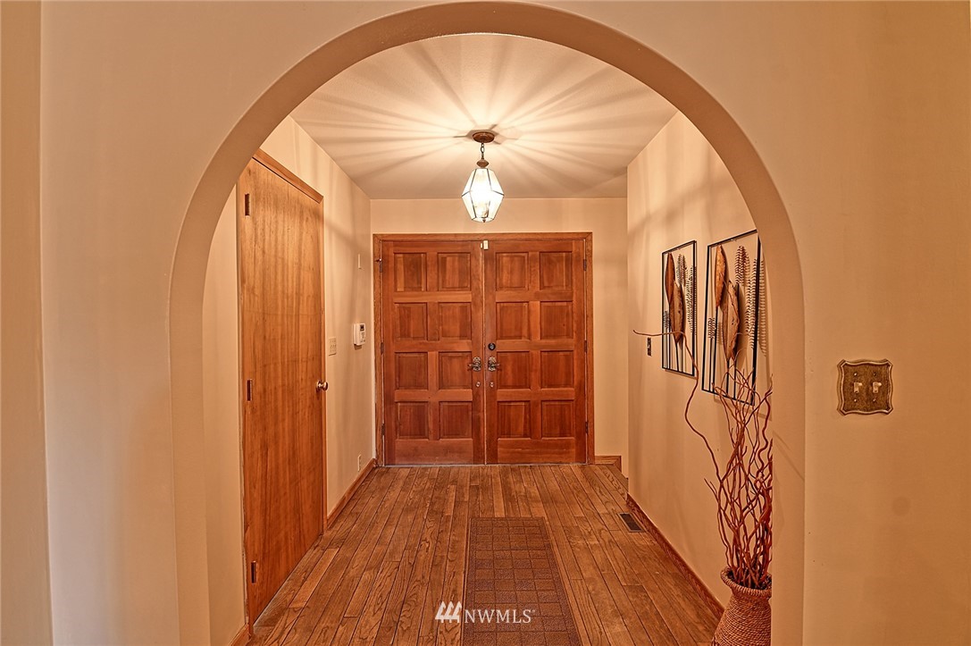 5011 228th Street Southeast Bothell, WA 98021 - Photo 3 of 40 a view of a hallway with wooden floor and entryway