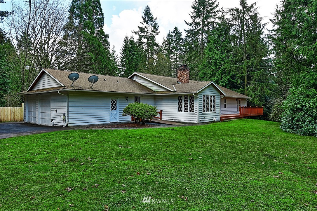 5011 228th Street Southeast Bothell, WA 98021 - Photo 39 of 40 a front view of a house with garden