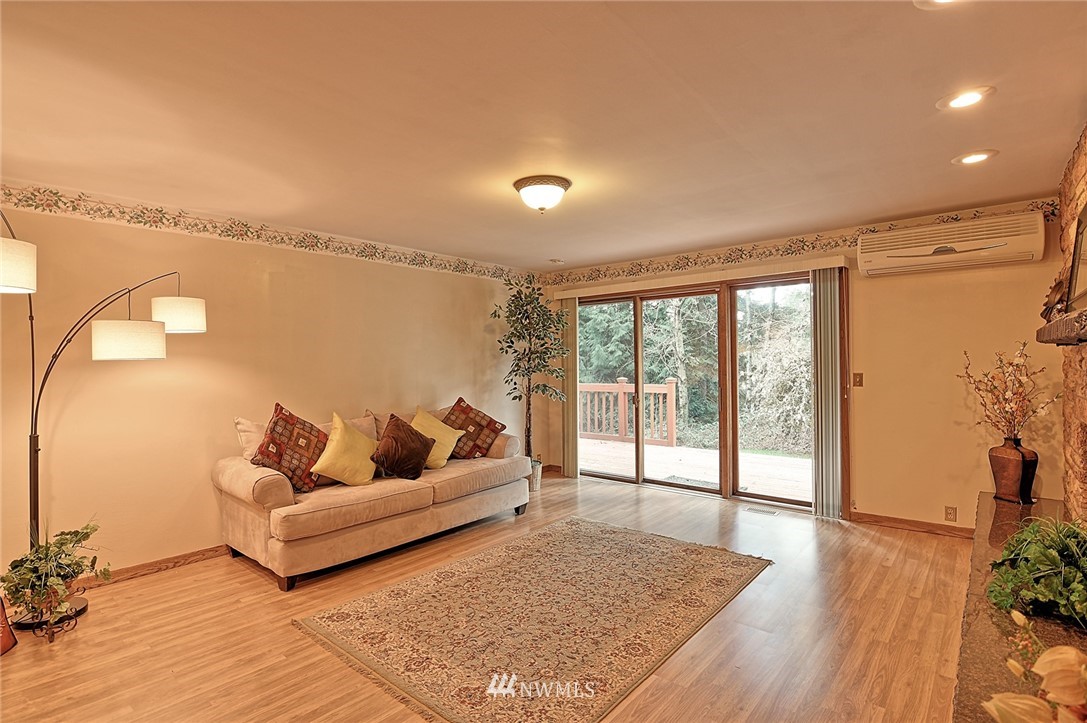 5011 228th Street Southeast Bothell, WA 98021 - Photo 5 of 40 a living room with furniture and a large window