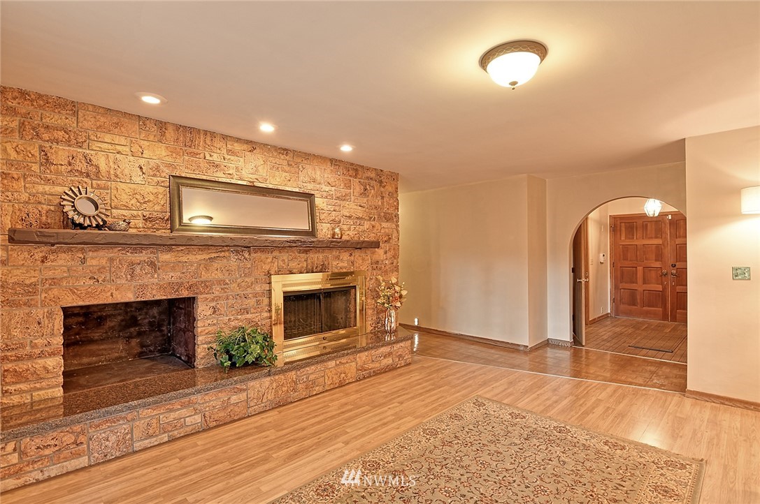 5011 228th Street Southeast Bothell, WA 98021 - Photo 6 of 40 a view of a livingroom with an empty space and a fireplace