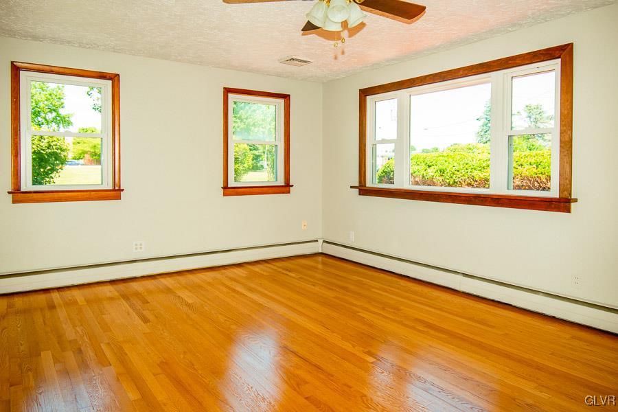 2121 7th Street Bethlehem, PA 18020 - Photo 2 of 14 a view of an empty room with a window and wooden floor
