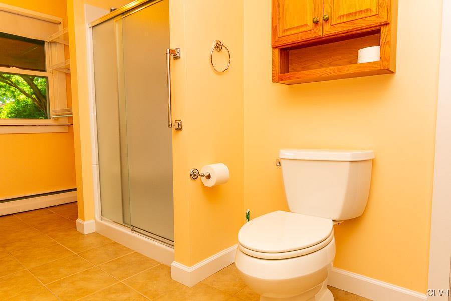 2121 7th Street Bethlehem, PA 18020 - Photo 9 of 14 a bathroom with a toilet and a shower