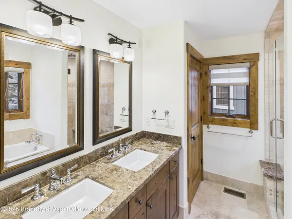 a bathroom with a bathtub and shower