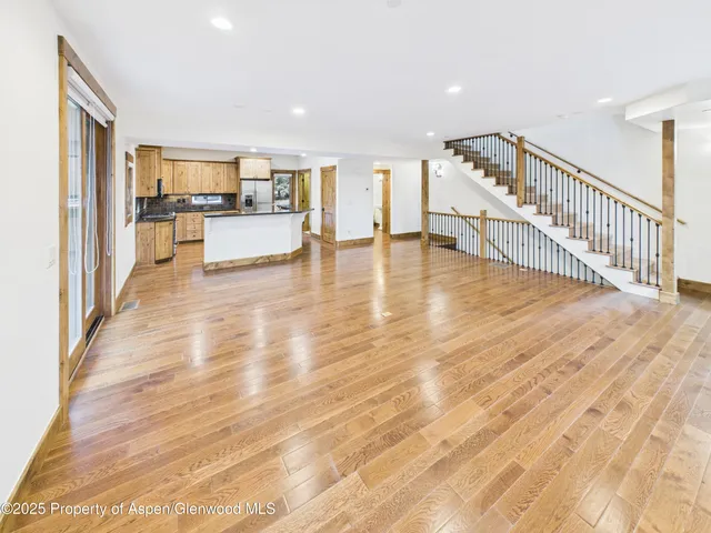 a view of a living room with a large window