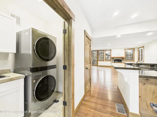 a view of kitchen with furniture and wooden floor