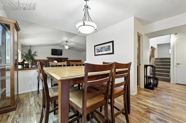 a view of a dining room with furniture and wooden floor