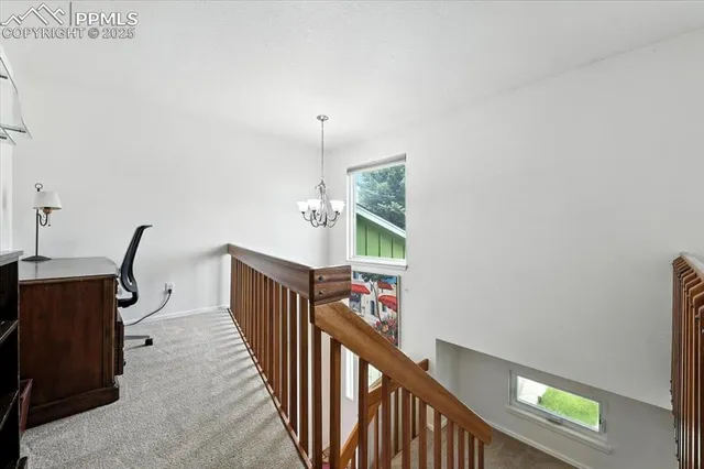 a view of a hallway with stairs