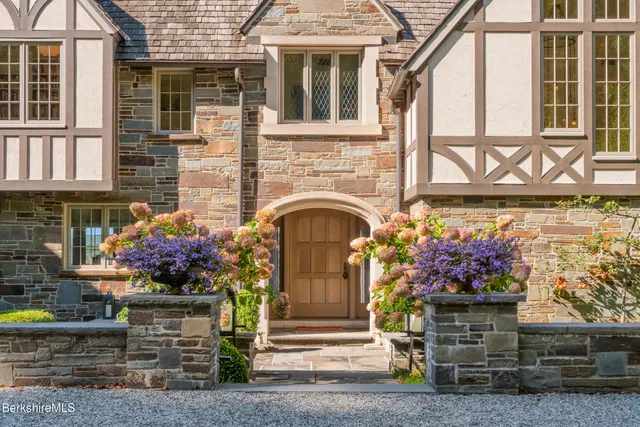 a view of entryway livingroom and hall with wooden floor