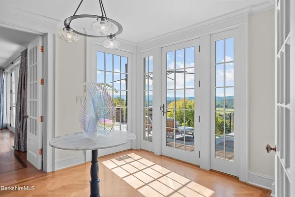 a view of a bedroom with a large window and a couch