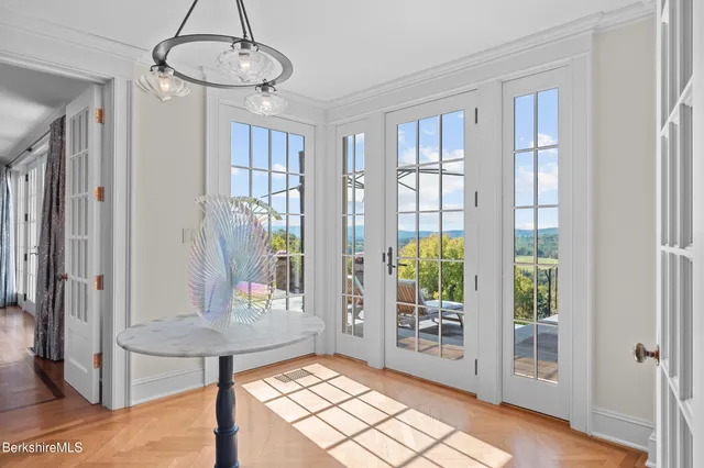 a view of a bedroom with a large window and a couch