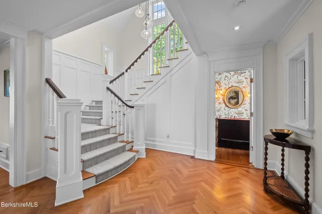 a living room with furniture and a book shelf